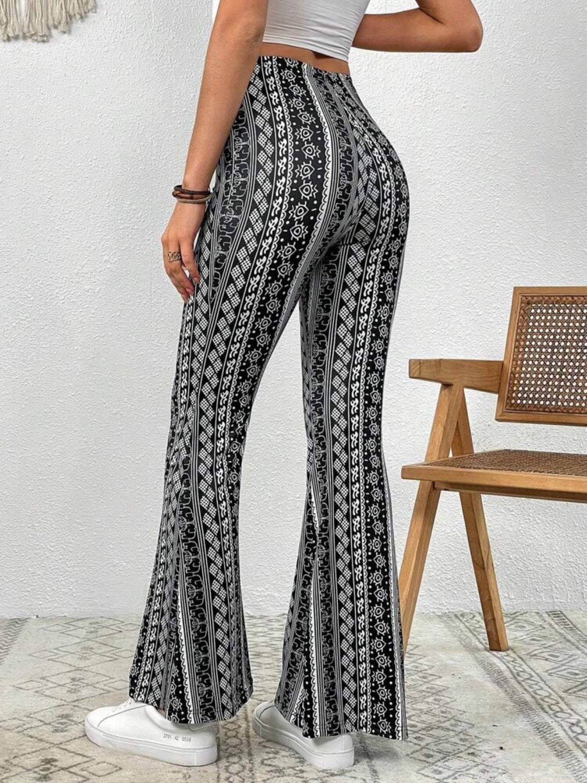 Forbidden Pants with the black design being showcased from the back.