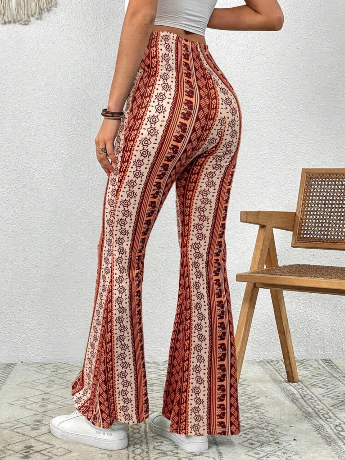 Forbidden Pants with the orange design being showcased from the back.