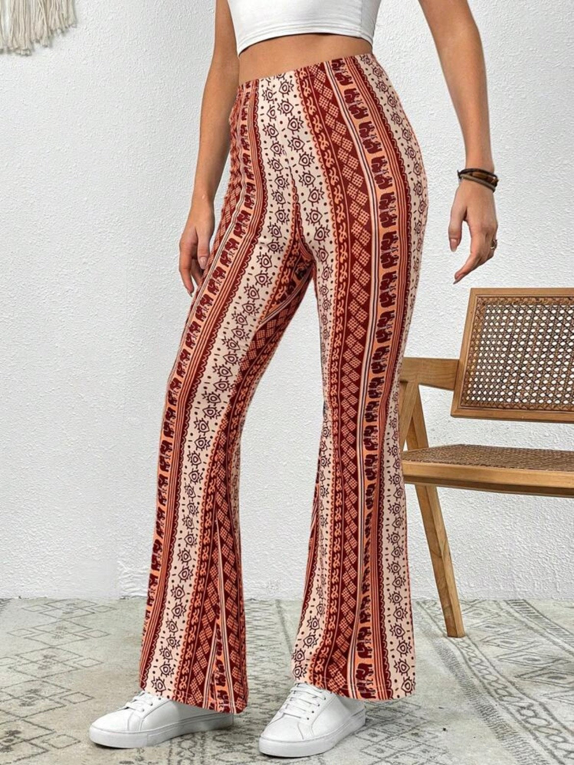 Forbidden Pants with the orange design being showcased from the first angle.